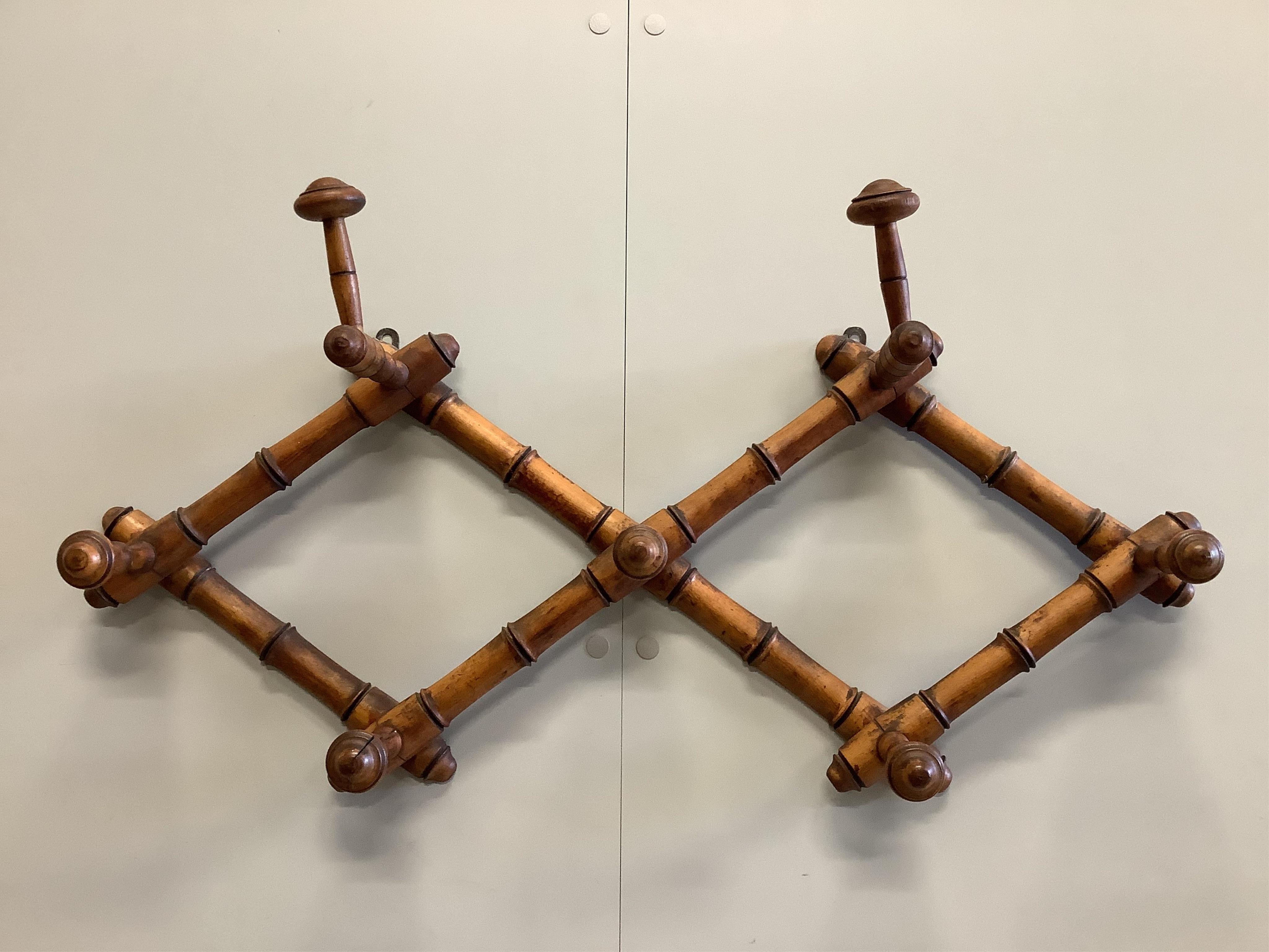 A near pair of simulated bamboo wall mirrors and a similar wall hanging coat rack, mirrors 63 x 52cm. Condition - fair to good